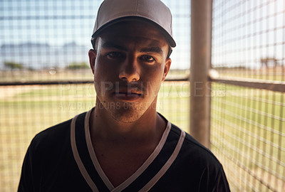 Buy stock photo Shot of a young man playing a game of baseball