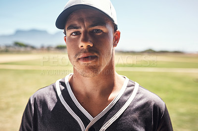 Buy stock photo Shot of a young man playing a game of baseball