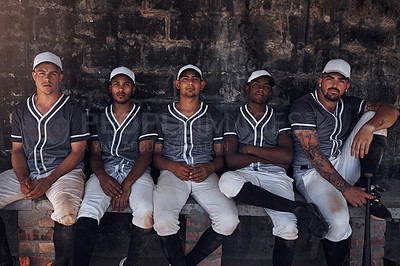 Buy stock photo Portrait of a group of young men sitting in the dugout at a baseball game