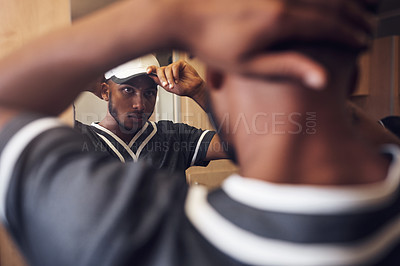 Buy stock photo Baseball player, cap and face of sports man in a locker room getting ready and dressing in mirror. Behind an African athlete person with reflection and hat for sport competition, training or exercise