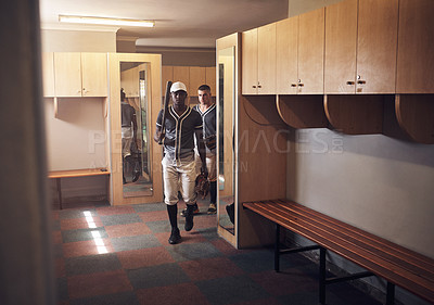 Buy stock photo Shot of young men walking into a locker room at a baseball game
