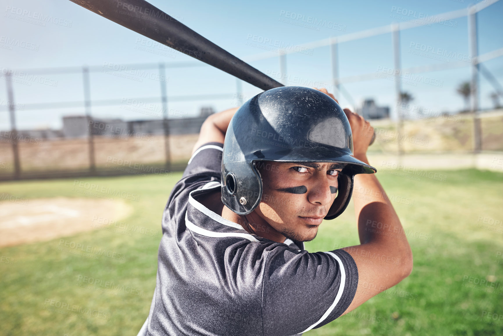 Buy stock photo Man, portrait and baseball bat for sports on field, grip and power posture for ready to swing or strike on game day. Player, serious and uniform on pitch in stadium for match, competition and homerun