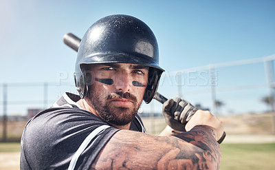 Buy stock photo Shot of a young man swinging his bat at a baseball game