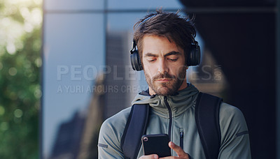 Buy stock photo Man, outside and smartphone with headphones for break with music, playlist and subscription. Male person, outdoor and mobile app with headset in balcony for listening to podcast, radio and song