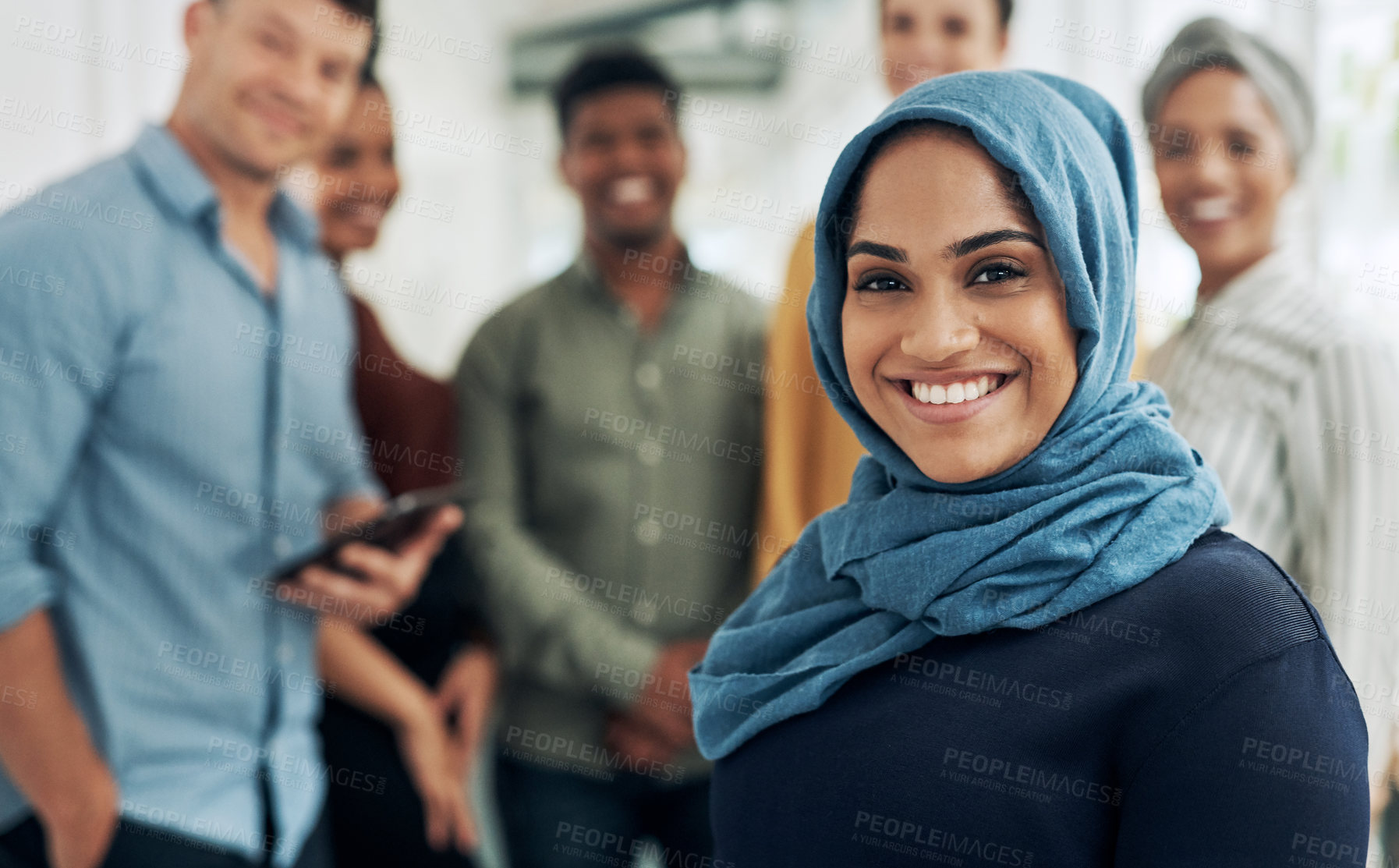 Buy stock photo Muslim woman, leader and team in office with portrait, smile and career with diversity at startup company. Person, manager and happy with hijab in group, excited or pride with job at creative agency