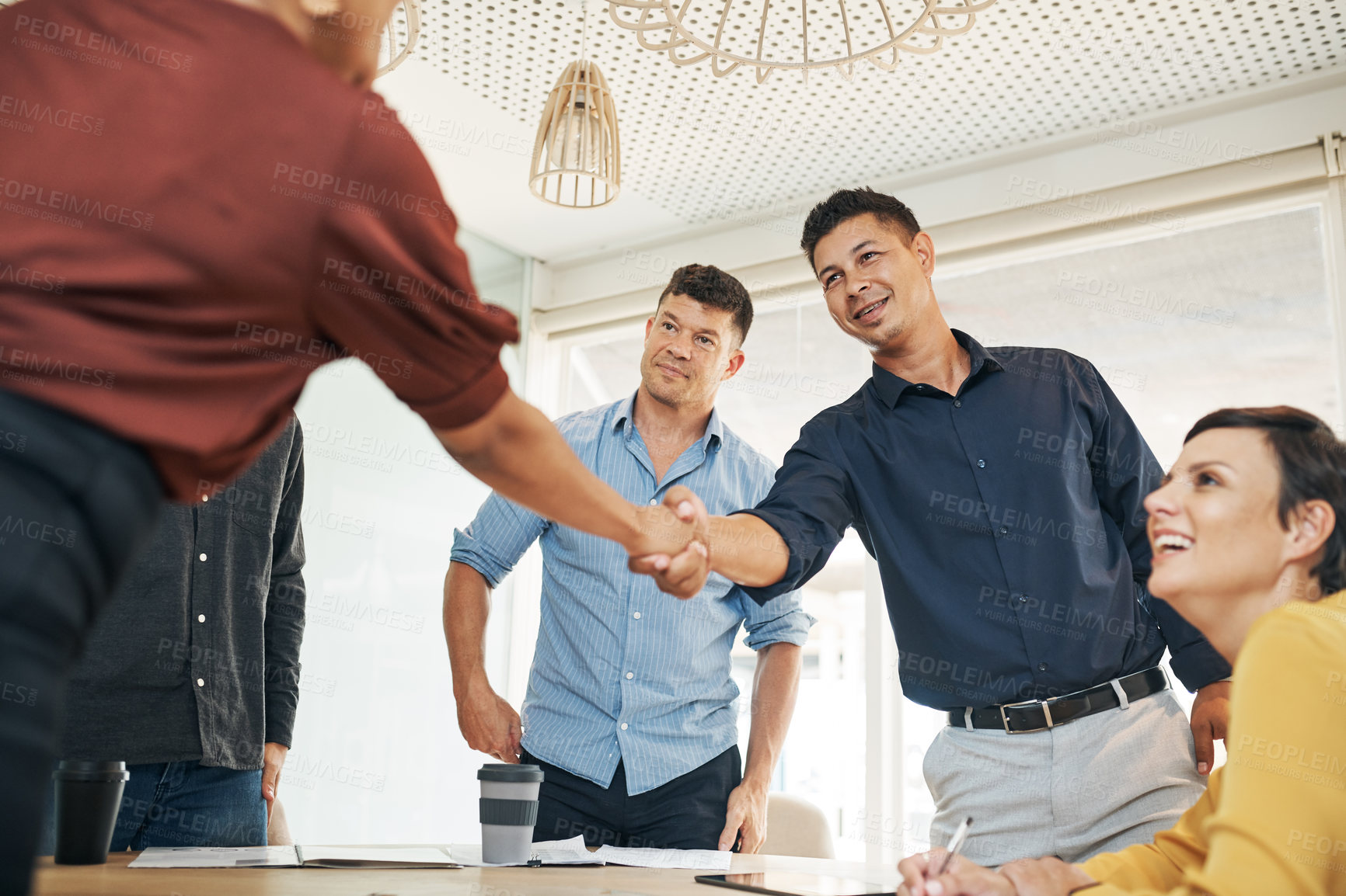 Buy stock photo Business people, meeting and handshake with team for hiring, recruiting or collaboration at office. Businessman, employees or coworkers shaking hands with smile for agreement or deal at workplace