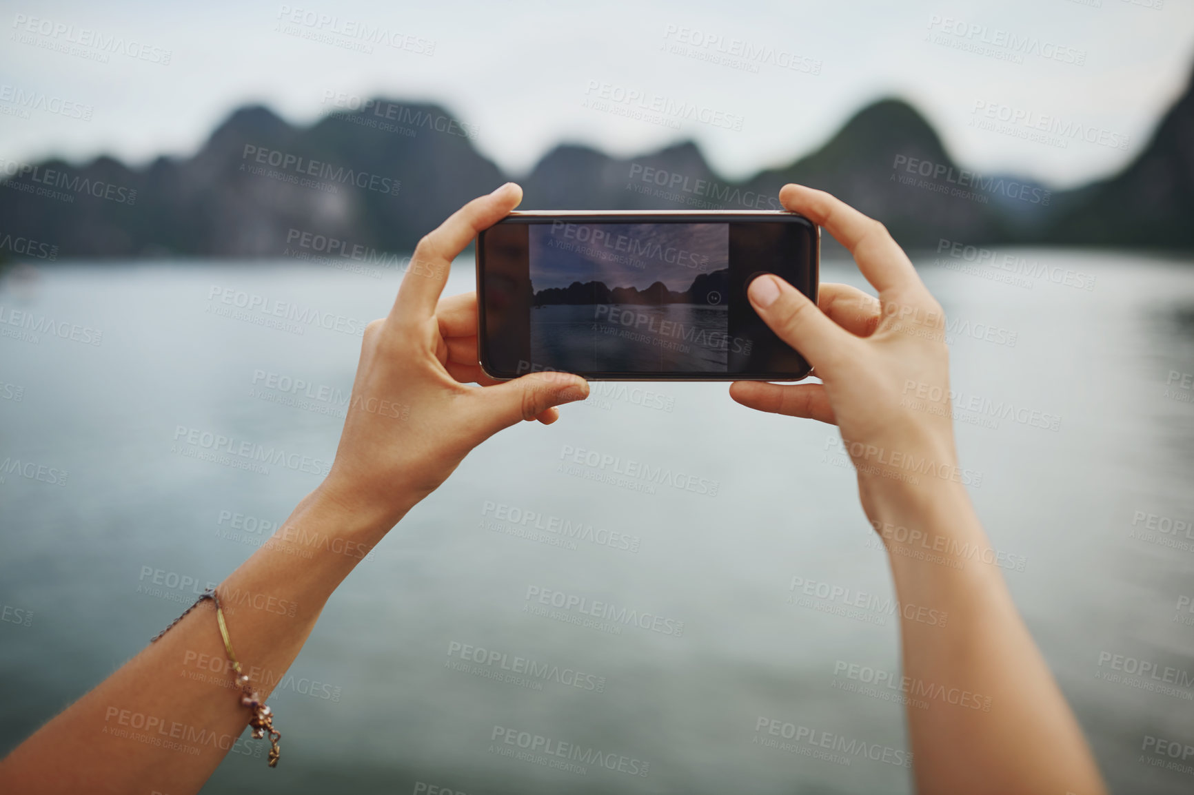 Buy stock photo Cellphone screen, photography and hands of woman by ocean for travel, vacation or weekend trip. Adventure, phone and female person with picture by sea on boat on holiday for memory or exploring.