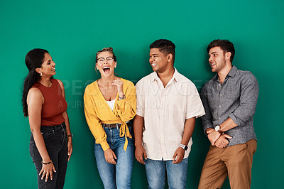 Buy stock photo Shot of a group of young designers standing together against a green background