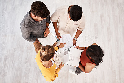 Buy stock photo High angle shot of a group of young designers having a discussion in an office
