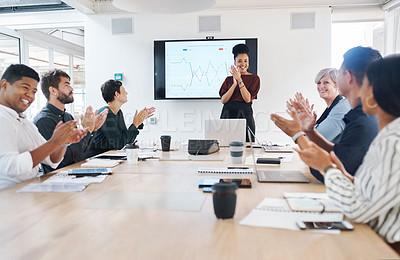 Buy stock photo Shot of a group of businesspeople clapping during a meeting in a modern office