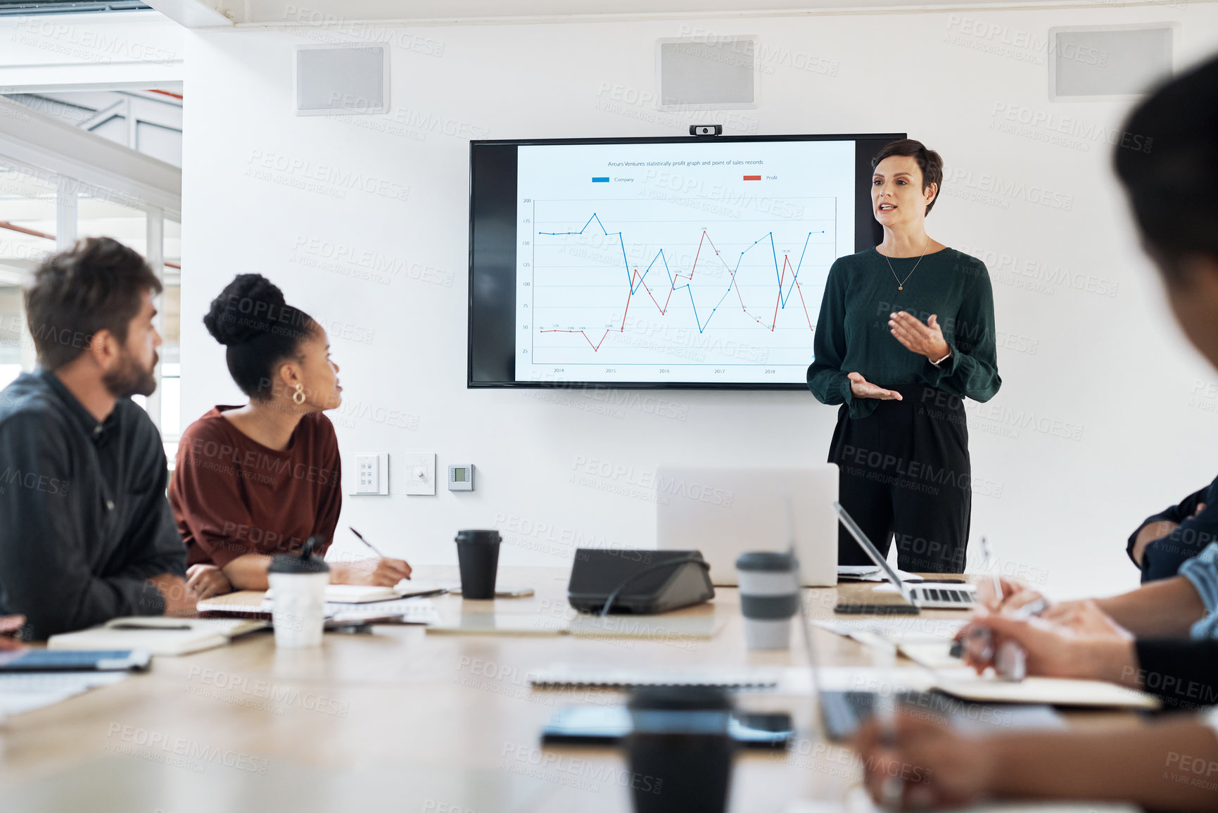 Buy stock photo Shot of a group of businesspeople having a meeting in a modern office