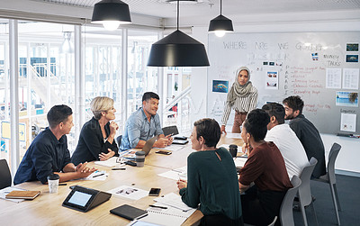 Buy stock photo Shot of a group of businesspeople having a meeting in a modern office