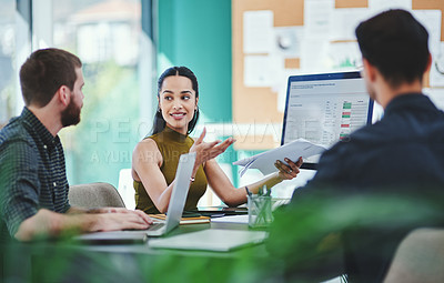 Buy stock photo Shot of a group of young designers having a discussion in an office