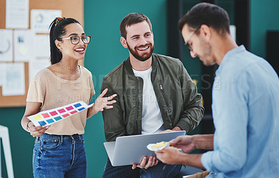 Buy stock photo Talking, laptop and creative in office, people and planning for project, teamwork and smile for pallet. Colleagues, confident and collaboration for graphic design, digital and proud for discussion