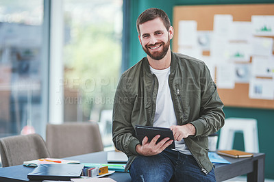 Buy stock photo Portrait of a young designer using a digital tablet in an office