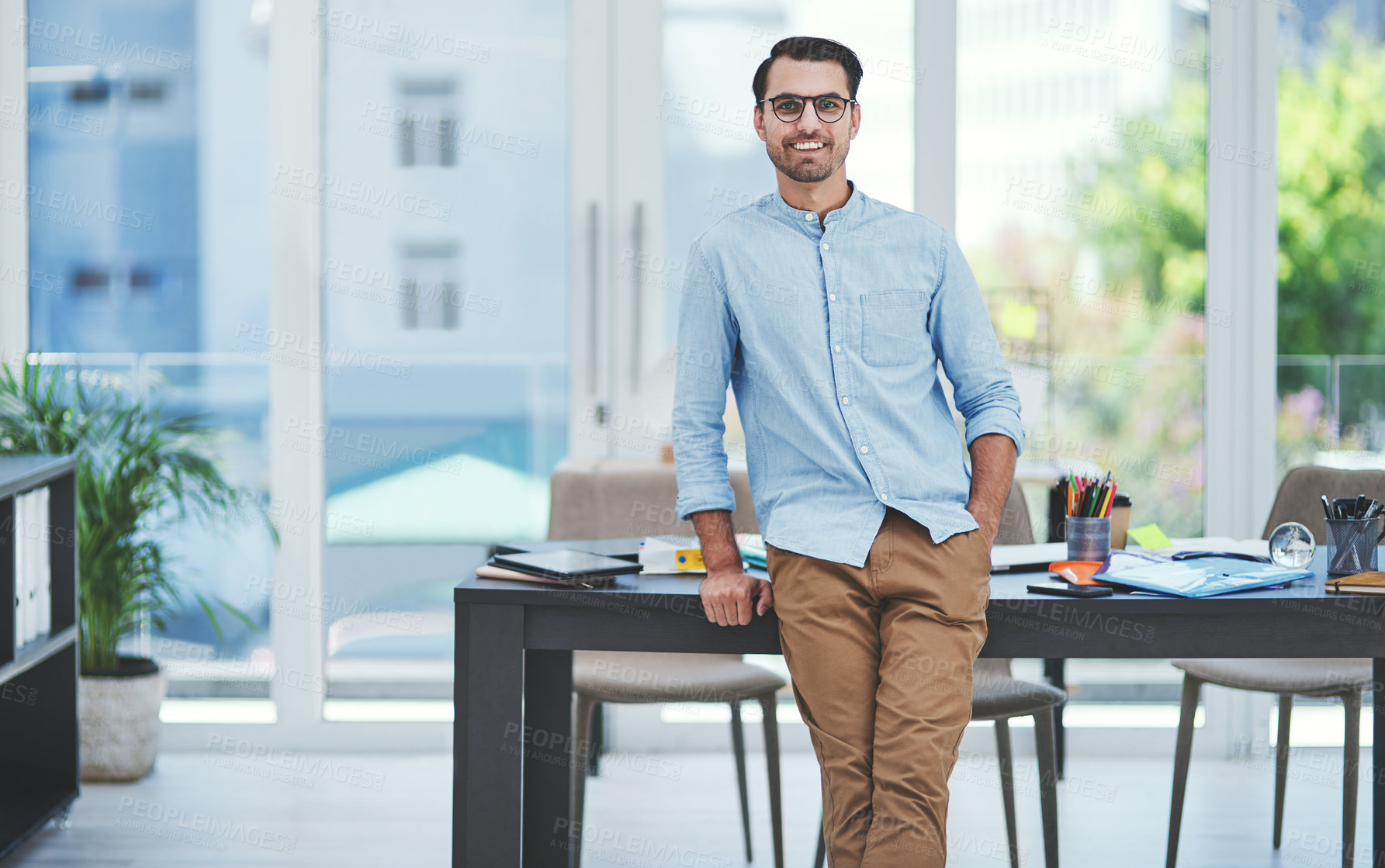 Buy stock photo Portrait of a young designer standing in an office