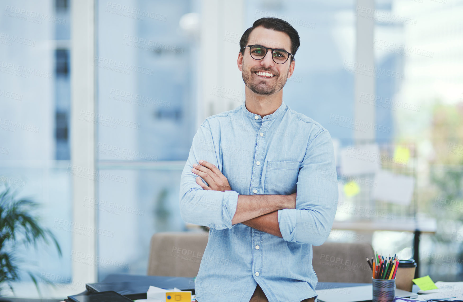 Buy stock photo Arms crossed, portrait and smile with designer man in creative workplace for startup career. Agency, business and confidence with happy design employee in professional office for web development