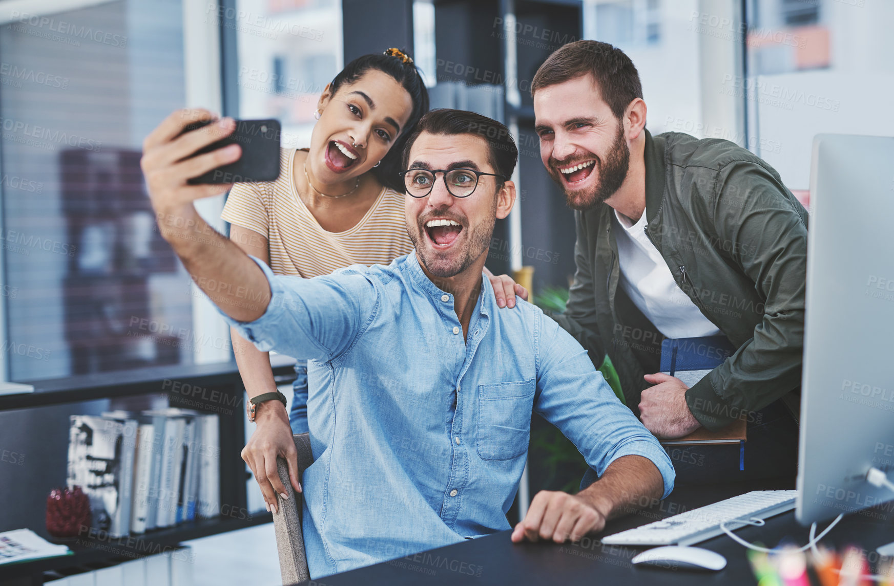 Buy stock photo Happy, business people and selfie with photography at office desk for memory or picture together. Young, group or employees with smile or team in joy for moment, capture or social media at workplace