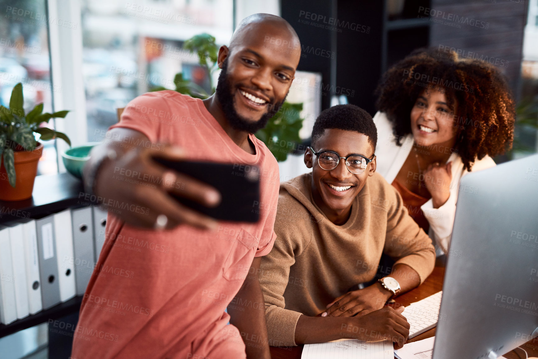 Buy stock photo Shot of a group of designers taking a selfie together