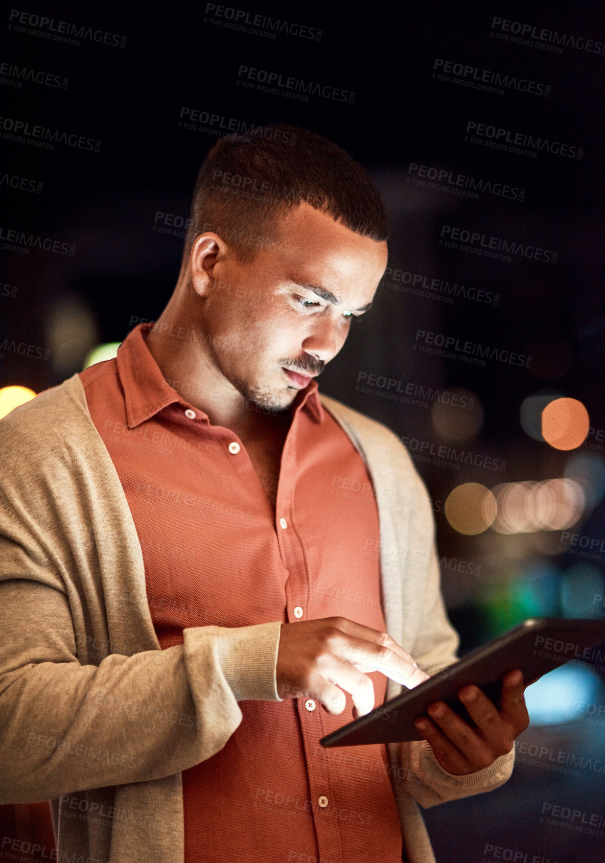Buy stock photo Cropped shot of a businessman using a digital tablet while standing outside