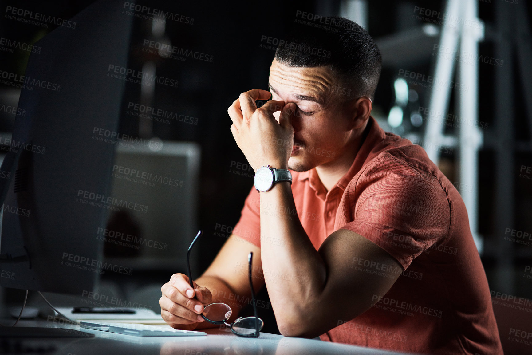 Buy stock photo Man, night and computer for eye strain at desk, fatigue and mental health burnout for online project. Male person, tired reporter and stress for article deadline, depression and journalist in office