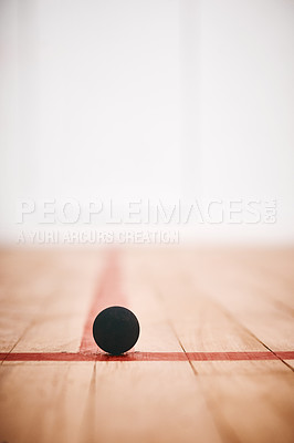 Buy stock photo Shot of a squash ball on the floor of a squash court