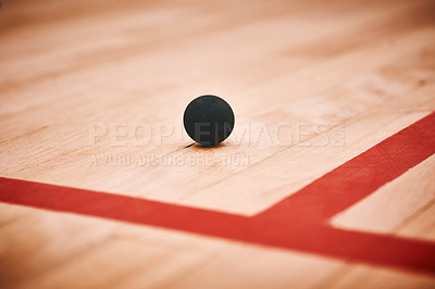 Buy stock photo Shot of a squash ball on the floor of a squash court
