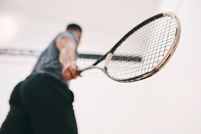 Buy stock photo Low angle shot of a man playing a game of squash