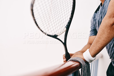 Buy stock photo Cropped shot of a man watching a game of squash from the viewing gallery