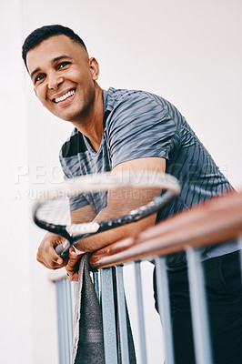 Buy stock photo Athlete, racket and man on balcony for sports with game view, challenge and entertainment. Fitness, happy and male tennis player by rail for performance review with competition gear at training.