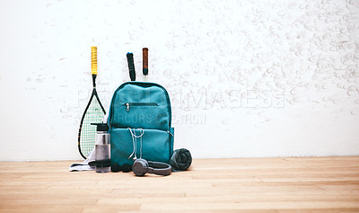 Buy stock photo Shot of a sports bag and other items in an empty squash court