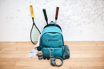 Buy stock photo Shot of a sports bag and other items in an empty squash court