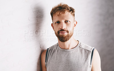 Buy stock photo Portrait of a young man leaning against a wall in a squash court