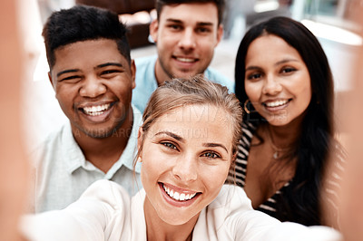 Buy stock photo Cropped portrait of a group of young business colleagues taking selfies in their office