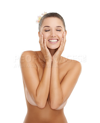 Buy stock photo Cropped shot of a gorgeous young woman smiling while posing nude against a white background