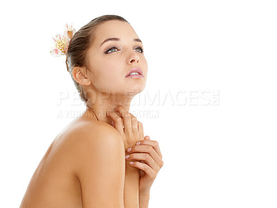 Buy stock photo Cropped shot of a gorgeous young woman posing nude against a white background