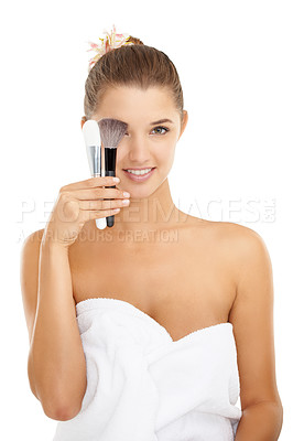 Buy stock photo Cosmetics, studio portrait and woman with brush for foundation application, skincare routine or facial treatment. Makeup tools, beauty salon and dermatology model with towel on white background