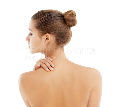 Buy stock photo Rearview shot of a gorgeous young woman posing topless against a white background