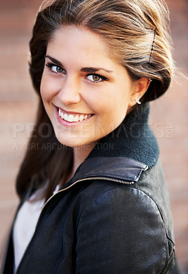 Buy stock photo Portrait of an attractive young woman outdoors in the city