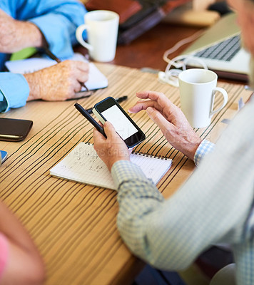 Buy stock photo Shot of three unidentifiable seniors having a meeting around a table at home