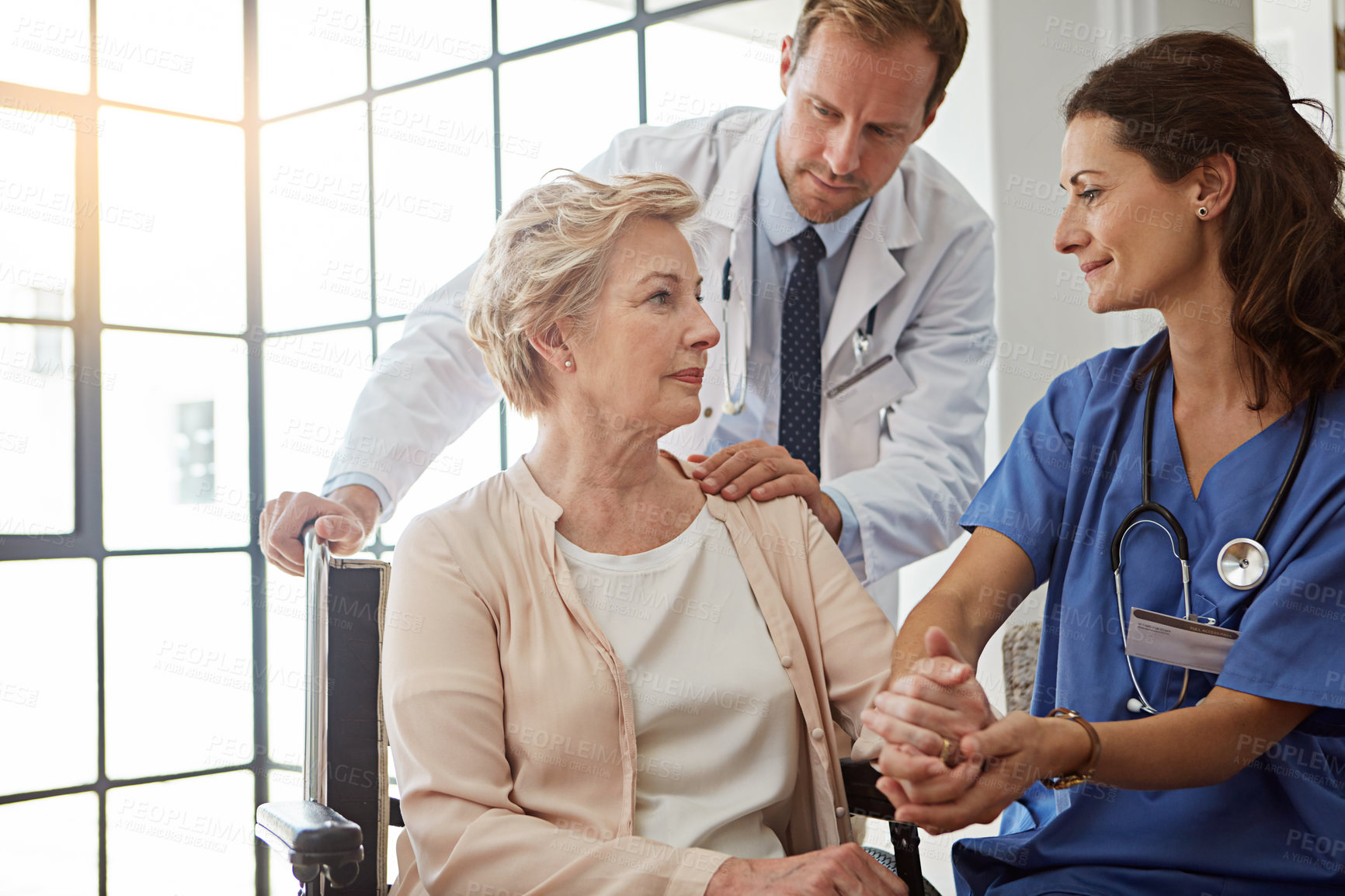 Buy stock photo Cropped shot of a senior woman in the retirement home with her doctor and nurse