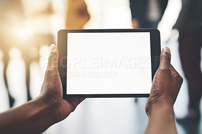 Buy stock photo Shot of an unrecognizable man using a tablet inside
