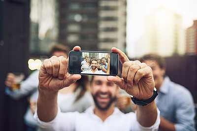 Buy stock photo Portrait of a group of cheerful young work colleagues taking a self portrait together outside during the day