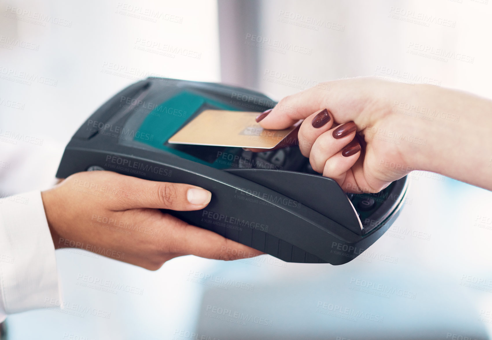 Buy stock photo Cropped shot of a customer using her credit card to make a payment