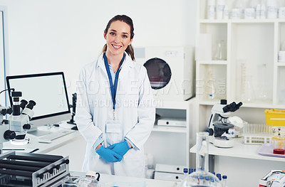 Buy stock photo Portrait of a cheerful young female scientist standing at her work station ready to work inside of a laboratory