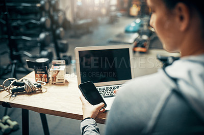 Buy stock photo Cropped shot of an unrecognizable woman using  her cellphone while sitting at her desk