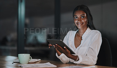 Buy stock photo Portrait of a young businesswoman using a digital tablet in an office at night