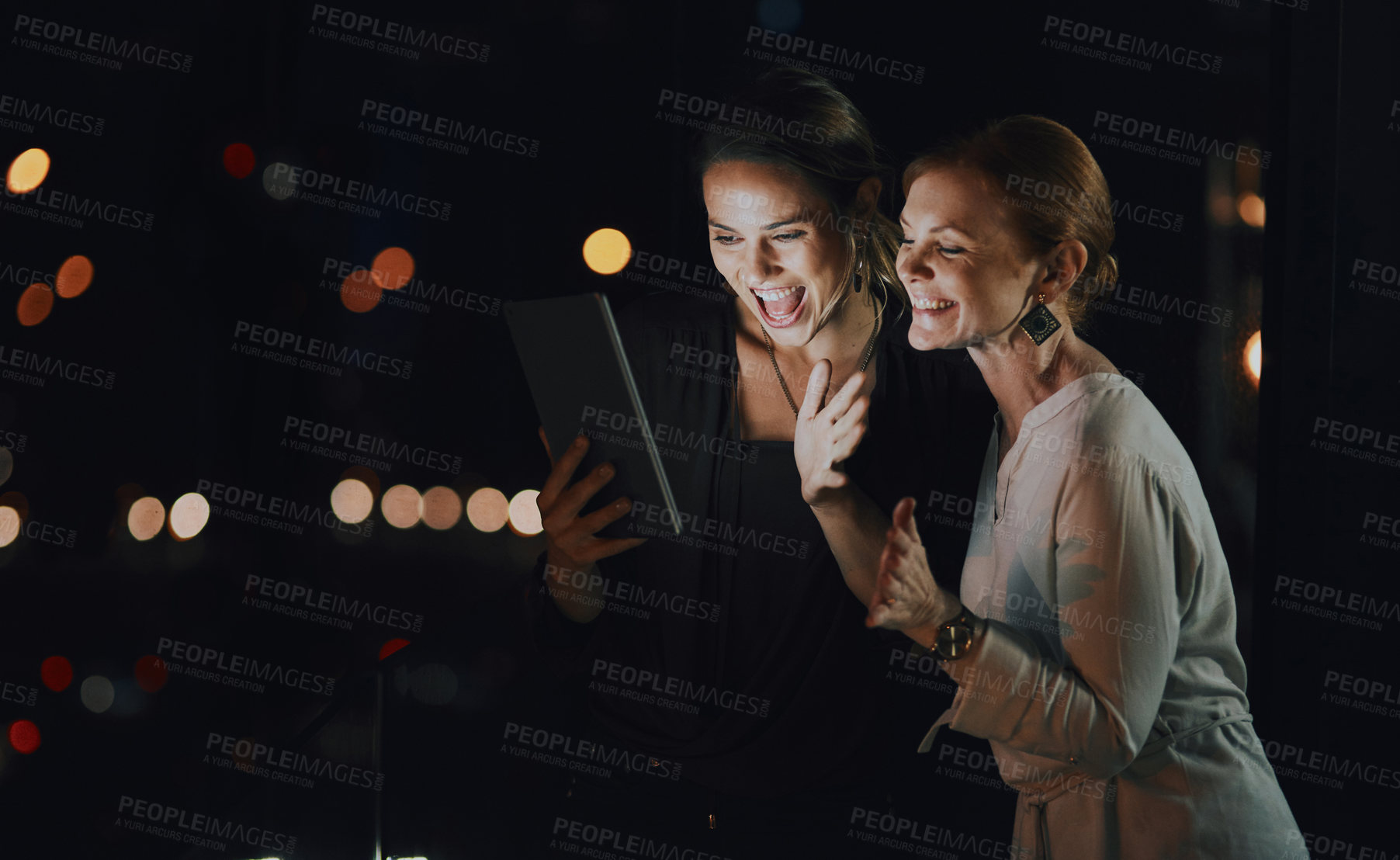 Buy stock photo Business people, night and women with tablet, excited and planning with email, deadline and happiness. Evening, employees and coworkers with tech, internet and research with cooperation for project