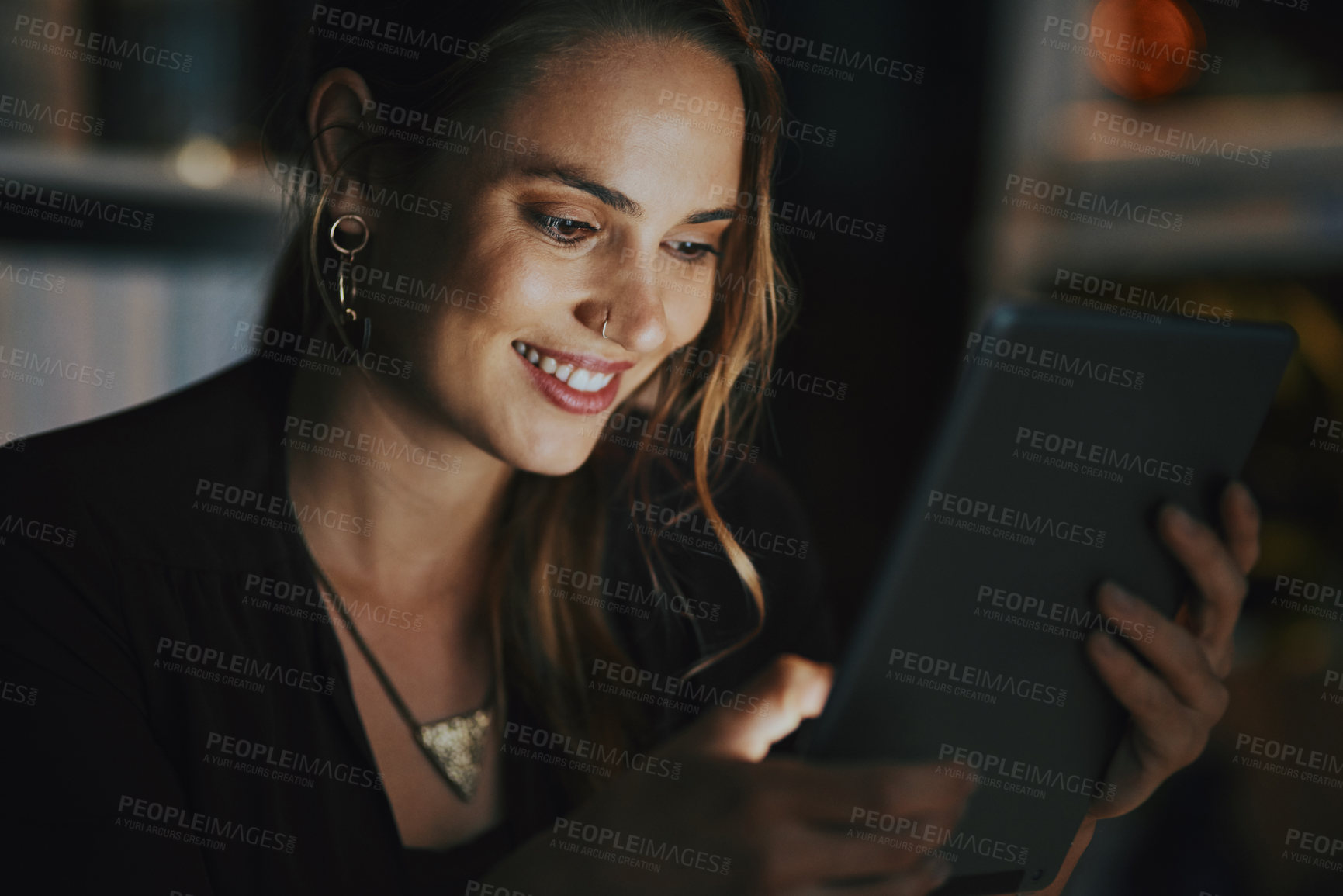 Buy stock photo Happy, reading and woman with tablet, night and feedback in email, success and smile for proposal. Office, entrepreneur and social media specialist with app, dark and working late for project