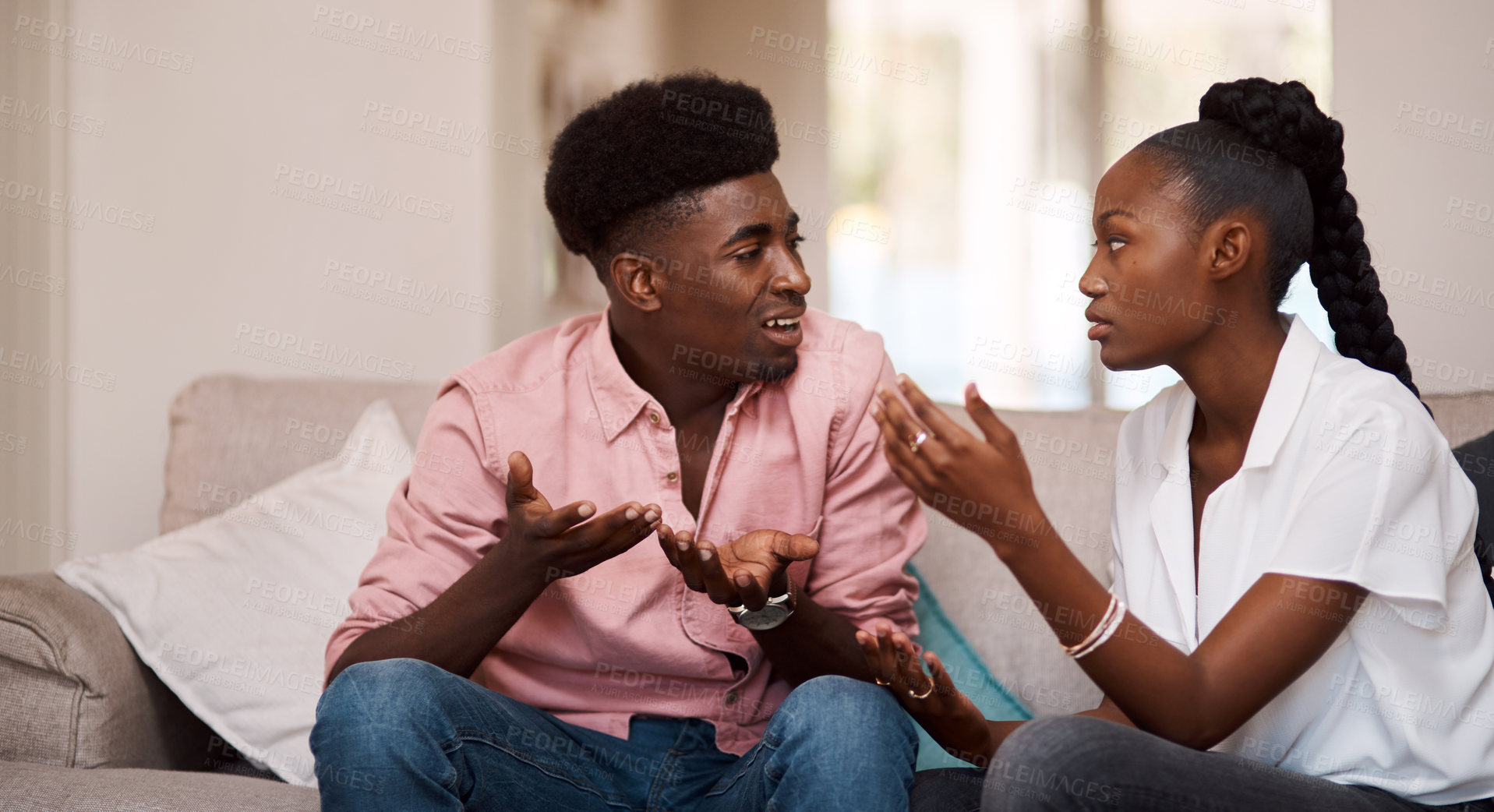 Buy stock photo Black couple, argument and fight with disagreement on sofa for dispute, conflict or divorce at home. Young African, man and woman in toxic relationshop, breakup or quarrel on lounge couch at house